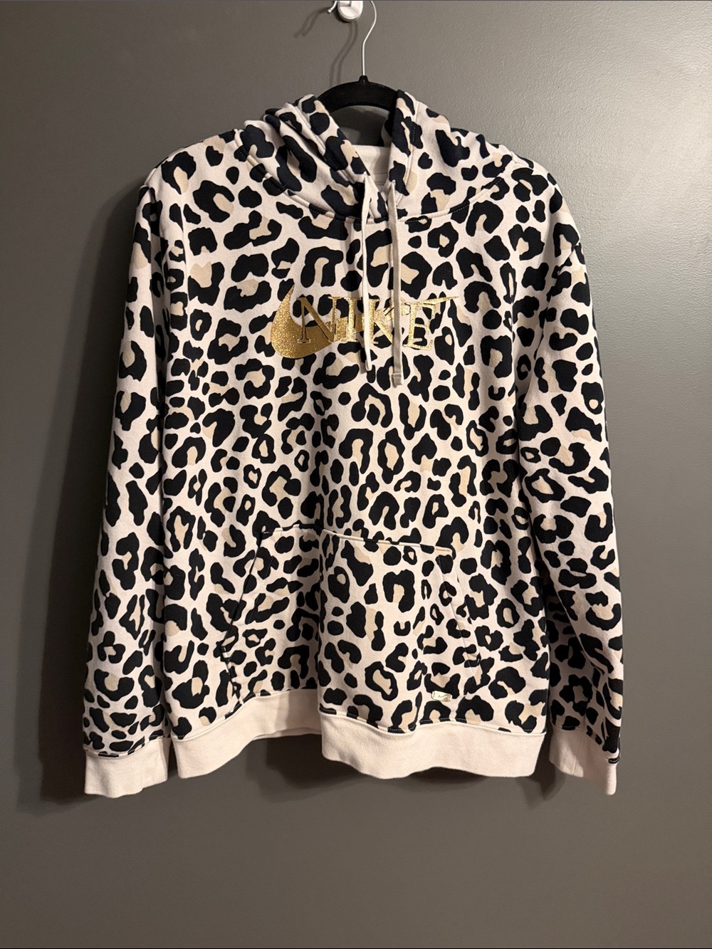 Nike Women's Black and Cream Leopard Hoodie with Gold Logo
